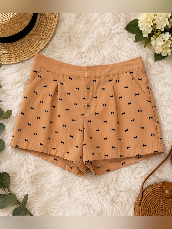 LC Lauren Conrad Pants - LC Lauren Conrad Tan with Black Bow Print Tailored Shorts Size 10